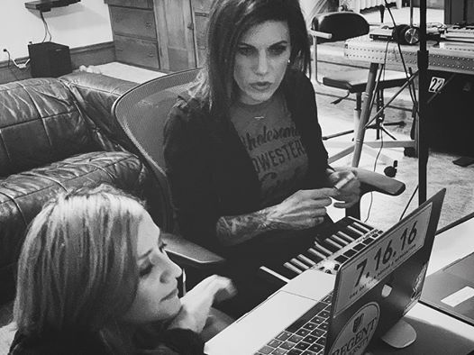Korey Cooper and Lacey Sturm at a laptop